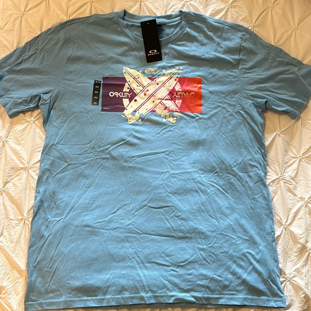 Brand new never worn Oakley printed tee , surf boards